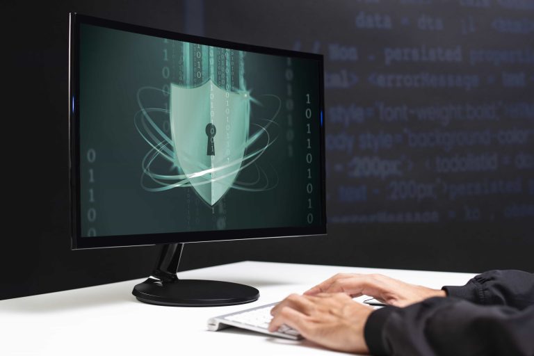 Cybersecurity concept with digital shield on computer screen