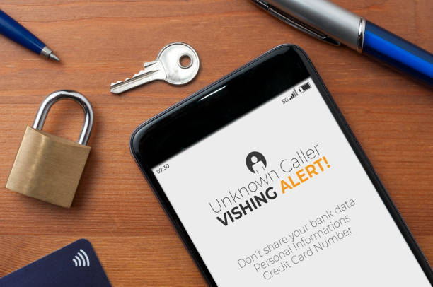 Vishing scam warning displayed on a phone screen, surrounded by symbols of financial security including a padlock and payment card.